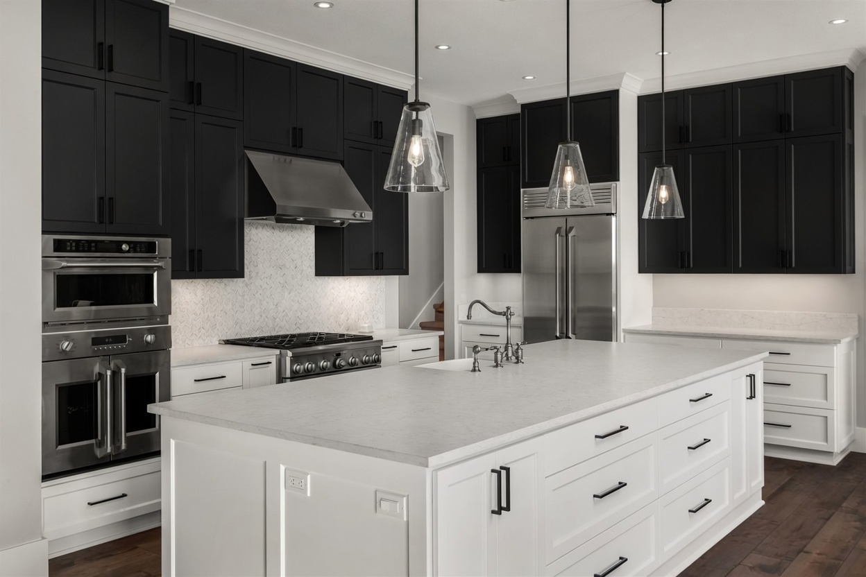 Same kitchen — black upper cabinets, white lowers